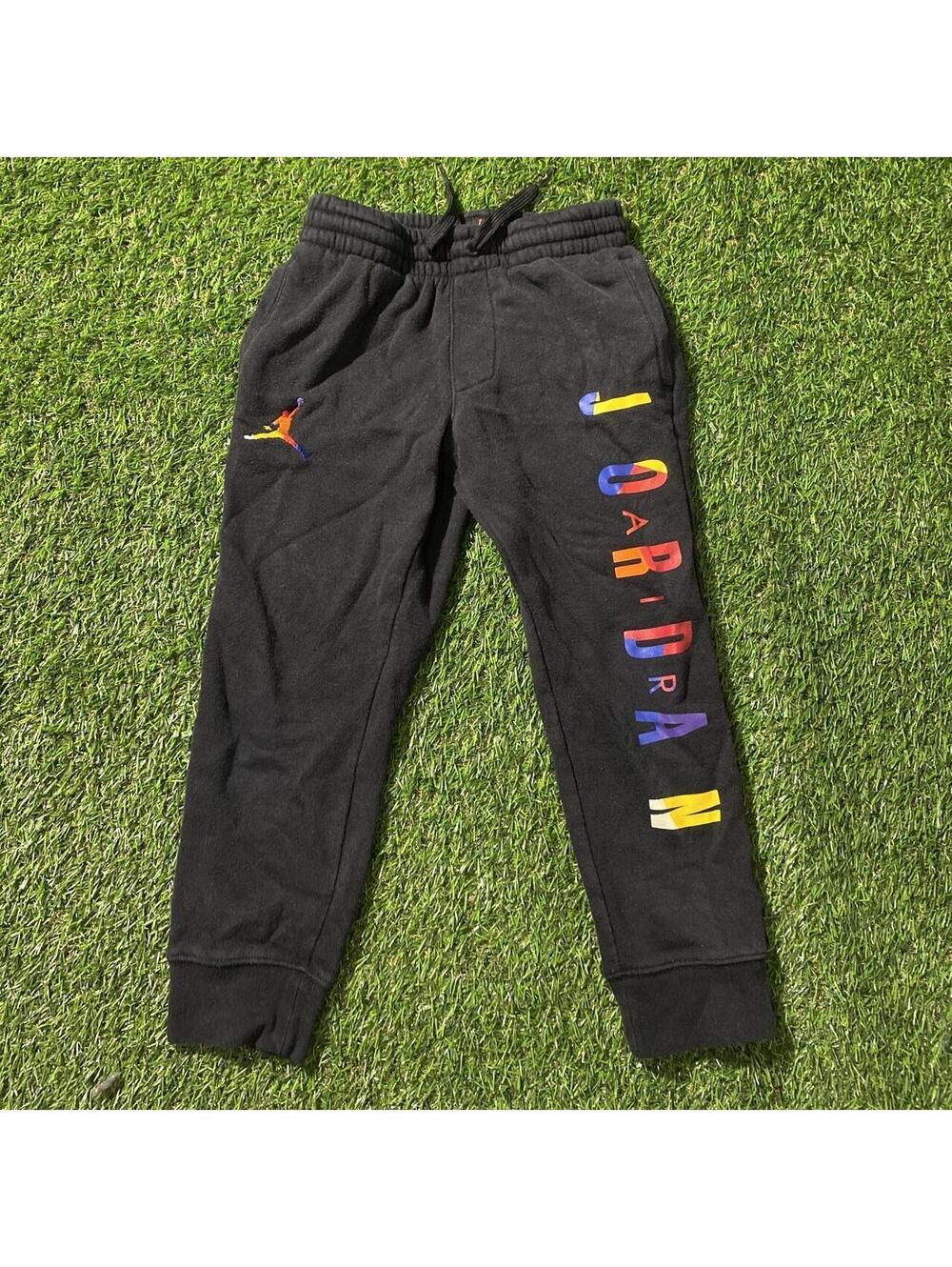 Jordan black joggers with multicolored 'JORDAN' text on the leg